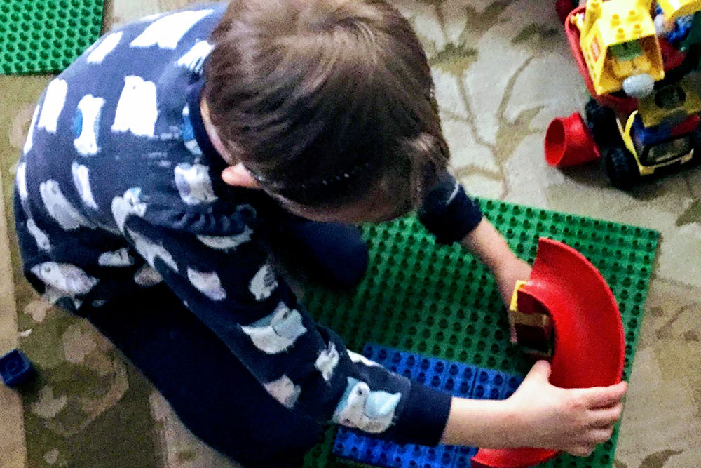 Child playing with Duplo Legos at May Jo’s Daycare in Maynard, MA Child playing with Duplo Legos at May Jo's Daycare in Maynard, MA